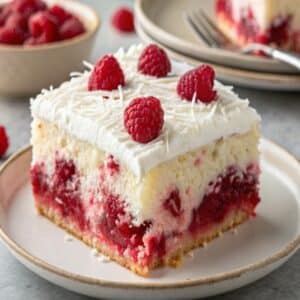 Raspberry Zinger Poke Cake: A Moist, Creamy, Coconut-Topped Delight