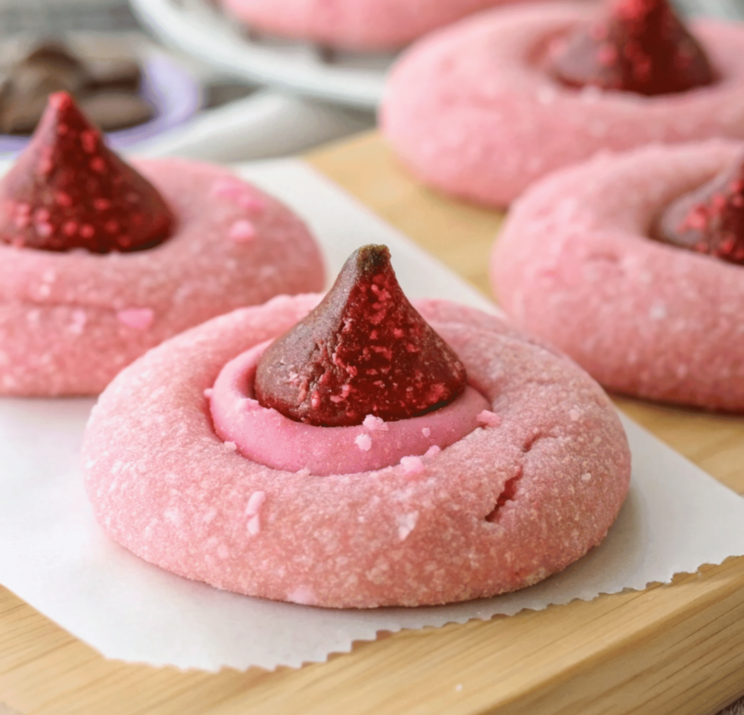 Strawberry Kiss Cookies 1 close up of vibrant pink sugar cookies coated in s 1 2 scaled